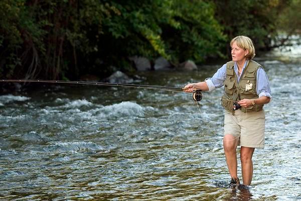 Woman fly fishing